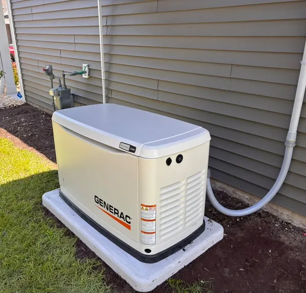 Standby generator installed beside a home